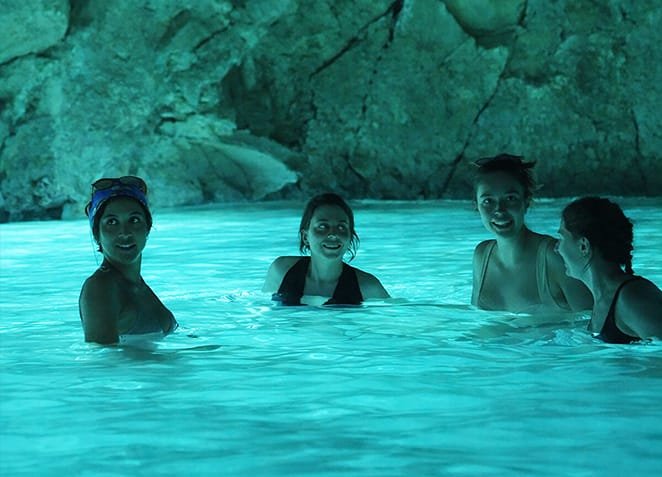 Tourists inside the blue cave in Vlore
